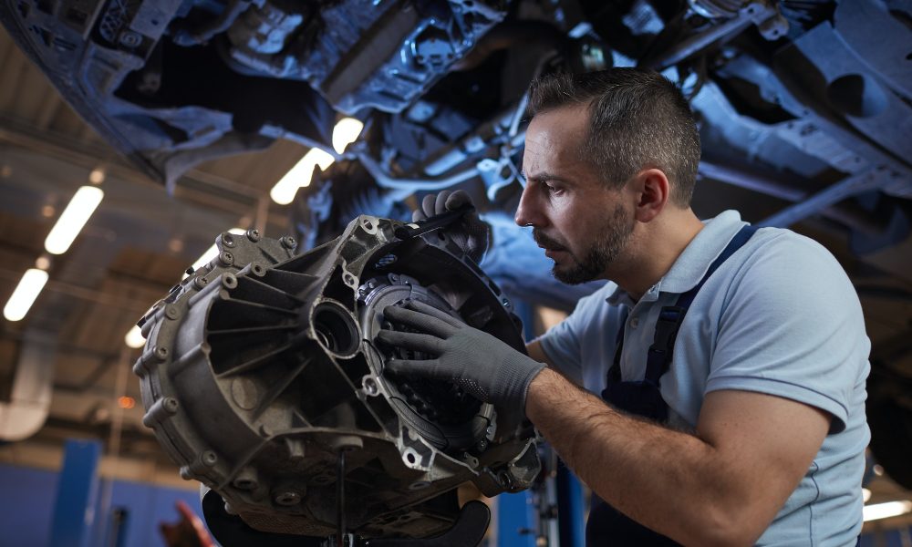 Auto Mechanic Fixing Car on Lift